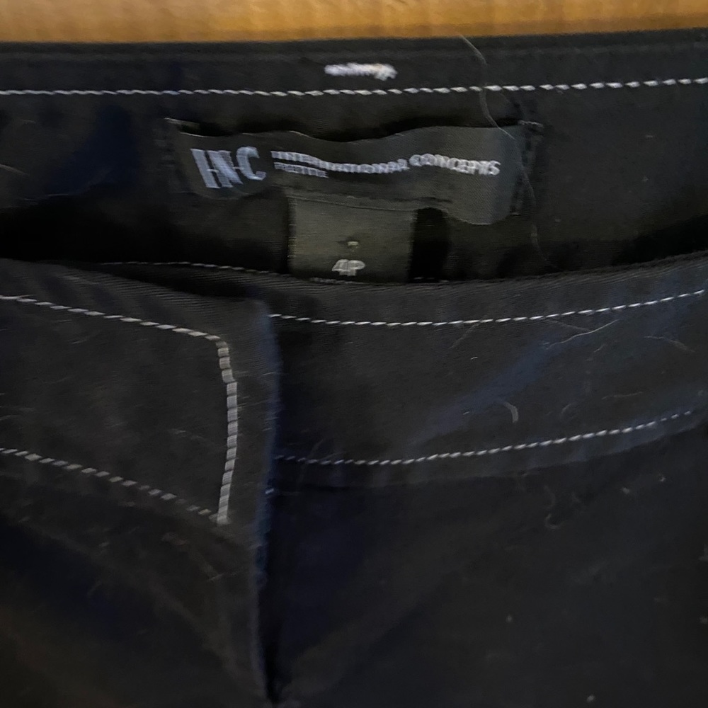 Black pants pocket with white button